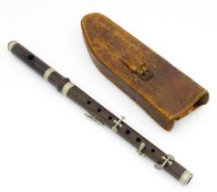 Musical instrument : a late 19thC piccolo flute by Hawkes & Son, two-piece rosewood body with nickel