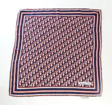 Vintage fashion / clothing: A Christian Dior silk scarf in red, white and navy. Approx. 25" x 25"