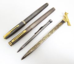 Pens and pencils to include an American silver fountain pen with 14kt gold nib by Sheaffer, a silver