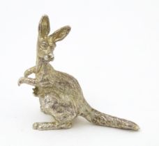 A silver model of a kangaroo and joeys, hallmarked London 2001. Approx. 1 1/2" high Please Note - we
