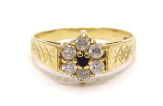 A 9ct gold floral cluster ring set with blue and white stones. Ring size approx. N Please Note -