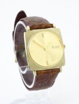 An Accurist 9ct gold square cased slim dress wristwatch, with Accurist leather strap. Watch case
