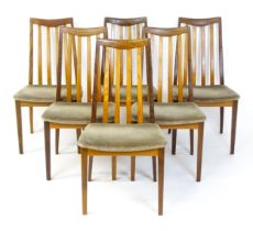 Vintage / Retro: A set of six teak G-Plan dining chairs with slatted backrests, shaped seats and