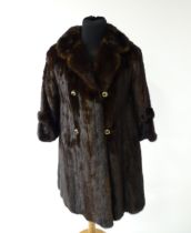 Vintage fashion / clothing: A double breasted mid length fur coat with 'Rebecca B' embroidered to