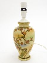 An Oriental table lamp of vase form with blossom detail. Character marks under. Approx. 12" high