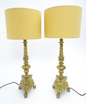 A pair of brass table lamps with triform bases. Approx. 28" high overall (2) Please Note - we do not