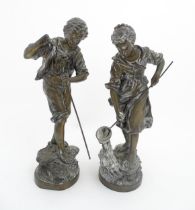 A pair of 20thC French cast fishing figures comprising man and woman, after Rancoulet. Cast