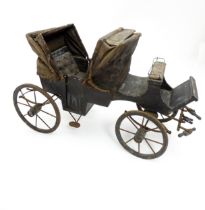 A Victorian wooden and metal model of a horse drawn carriage with hinged doors to passenger
