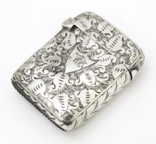 A Victorian silver vesta case with engraved decoration, hallmarked Birmingham 1890. Approx. 1 3/4"