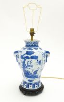 A Chinese blue and white ceramic table lamp of baluster vase form with twin mask handles and