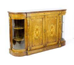 A Victorian burr walnut credenza with a bowed front and moulded top above an intricately inlaid