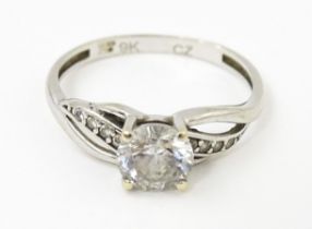 A 9ct white gold ring set with cubic zirconia. Ring size approx. N 1/2 Please Note - we do not