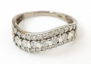 A 9ct white gold ring set with diamonds. Ring size approx. P Please Note - we do not make