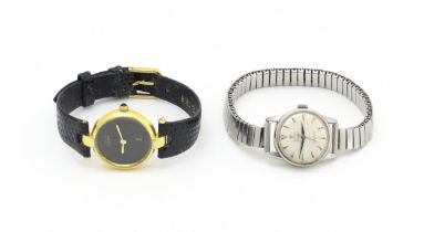 A ladies Omega Ladymatic wristwatch. Together with a quartz wrist watch, the dial signed Must de