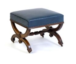 A Victorian 19thC mahogany Gothic stool, the leather upholstered seat raised on an x-frame base with