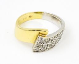 A 18ct yellow and white gold ring set with diamonds. Ring size approx. N Please Note - we do not