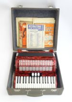 Musical instrument : a cased Hohner 'Concerto II S' accordion in red pearloid finish, serial