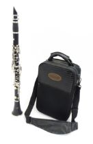 A Wisemann DCL-260 clarinet, serial number 13022181, in its fitted case with sheet music, approx 26"