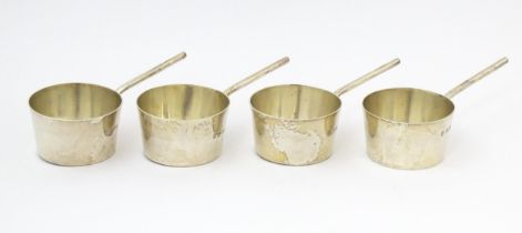 A set of four silver brandy /spirit warming saucepans, hallmarked London 1904, maker Josiah Williams