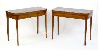 A pair of Regency mahogany tea tables, both with hinged and rotating crossbanded tops raised on four