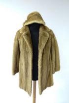 Vintage fashion / clothing: A vintage mink fur coat with an accompanying mink fur hat.