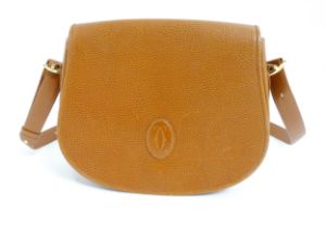 A Must De Cartier leather shoulder flap bag with magnetic fastening. Width approx. 11 1/2" Please