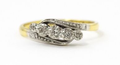 An 18ct gold ring with platinum set diamonds. Ring size approx. N Please Note - we do not make