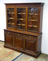A late 19thC mahogany glazed bookcase by S & H Jewell, Queen Street, London. The cornice with