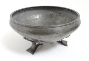 An Arts & Crafts Liberty & Co. Tudric pewter bowl of circular tapering form with hammered decoration