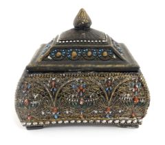 An Asian ceramic casket / caddy with scrolling enamel decoration. Approx. 7 3/4" high x 8 1/2"