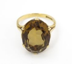 A 9ct gold ring set with central citrine. Ring size approx. N Please Note - we do not make reference