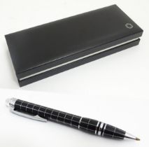 A cased Montblanc StarWalker ballpoint pen, in black finish with linear decoration. With service