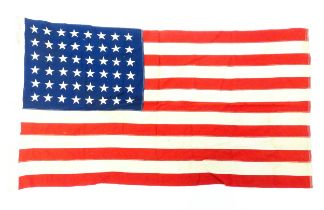 Militaria : a mid 20thC 'stars and stripes' flag of the United States of America, with 48 stars.