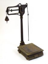 A late 19thC W.T. Avery Pattern No. 139 cast iron platform weighing scale with jockey weighing