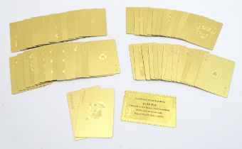 Toys: A 20thC set of gold foil playing cards, with certificate of authenticity. Please Note - we