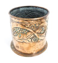 An Arts & Crafts copper jardiniere with embossed banded decoration depicting stylised scrolling