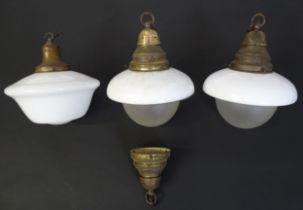 A pair of pendant lights of acorn form with opaline and frosted glass shades. Together with another.