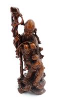 An Oriental carved hardwood figural group modelled as Shao Lao with attendant. Approx. 12 1/2"
