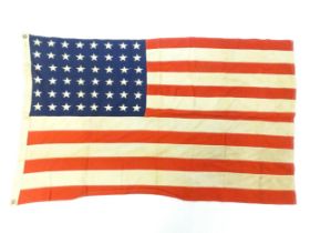 Militaria : a mid 20thC 'stars and stripes' flag of the United States of America, with 48 stars.