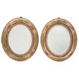 Mirrors. An attractive pair of late Victorian oval giltwood mirrors