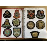 Badges. A collection of military and university bullion embroidered badges