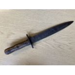 Fighting Knife. A WWII Italian 'MVSN' fighting knife with folk art carved grips