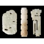 Jade. A Chinese white jade toggle and two panels