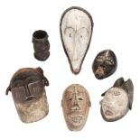 Tribal Art. A collection of African tribal masks and cup