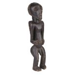 African Carving. A 20th century African carved wood fertility figure