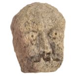 Ancient Stone Carving. A carved stone head, probably Medieval and carved in oolite limestone