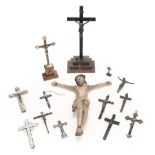 Crucifixes. A collection of crucifixes including a 19th century carved wood figure of Christ