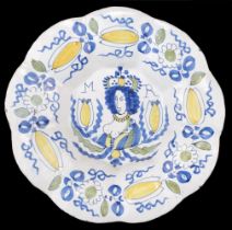 Dutch Delft. A rare William III delft charger circa 1690