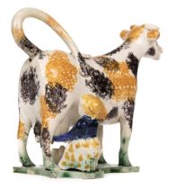 Cow Creamer. An 19th century Yorkshire creamware cow creamer and cover