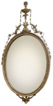 Mirror. A 19th century Adam's style gilt moulded oval mirror